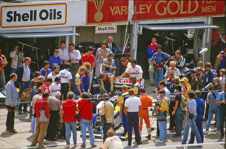 Nelson Piquet’s Williams surrounded by photographers at the British Grand Prix