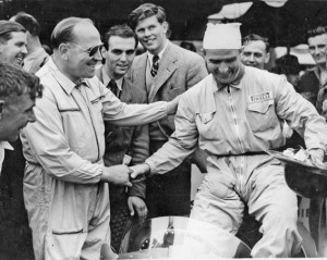 Reg Parnell, left, with another early member of the Grand Prix Drivers Club, “Nino” Farinaa whilst future member, Tim Parnell, stands tall in the background.
