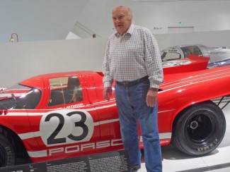 David Piper poses beside the Herrmann Attwood 1970 Le Mans winning Porsche 917