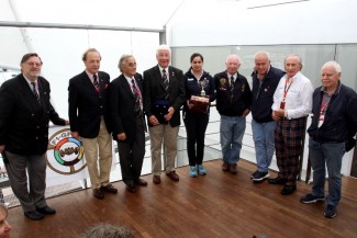 Monisha Kaltenborn receives the Jean Sage Memorial Award from President Howden Ganley and joined by,left to right, General Secretary Theo Huschek ,Antoine Seyler, Nannni Galli, Howden, Monisha, Teddy Pilette, Patrick Tambay, Sir Jackie Stewart and Jos Vonlanthen.(Photo Axel Schmidt)