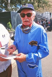 De Graffenried signs autographs at a historic event which gave him the change to get back into racing overalls.