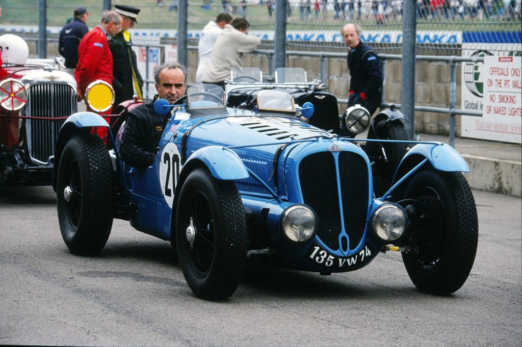 Jean at the wheel of his beloved Delahaye sports car at Silverstone in England