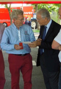 Nearly fifty nine years later Graham Gauld shows Enzo’s son, Piero Ferrari, the photograph above. <em>(Photo courtesy Peter Meierhofer)</em>