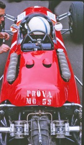 Ferrari chief engineer Mauro Forghieri, left with John and the classic flat 12 Ferrari grand prix car.