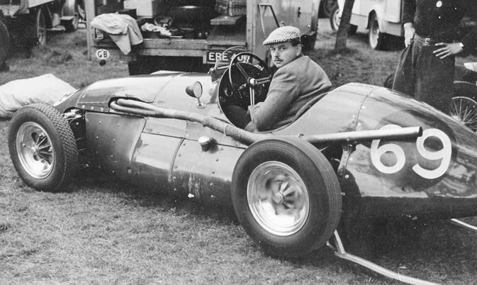 Ken with his new Connaught Formula 2, car warming up the back axle on a stand. (Photo Ken Downing Archive)