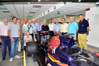 GPDC members with the latest Toro Rosso grand prix car in the factory. Left to right, Claude Le Guezec, Emanuele Pirro, Club Secretary Theo Huschek, Jo Ramirez, Tim Schenken, Hans Herrmann, Howden Ganley, Franz Tost Principal Toro Rosso, Teddy Pilette, Mario Theissen, Graham Gauld, Antoine Seyler, Reine Wisell and Dr Gerald Brandstetter. (Photo Peter Meirhoffer)