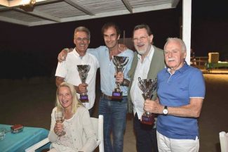 The Soap Box podium: Mario Theissen,3rd) Emanuele Pirro (Winner), Theo, Jo Vonlanthen (3rd) plus Christina Vonlanthen with celebratory glass of champagne.