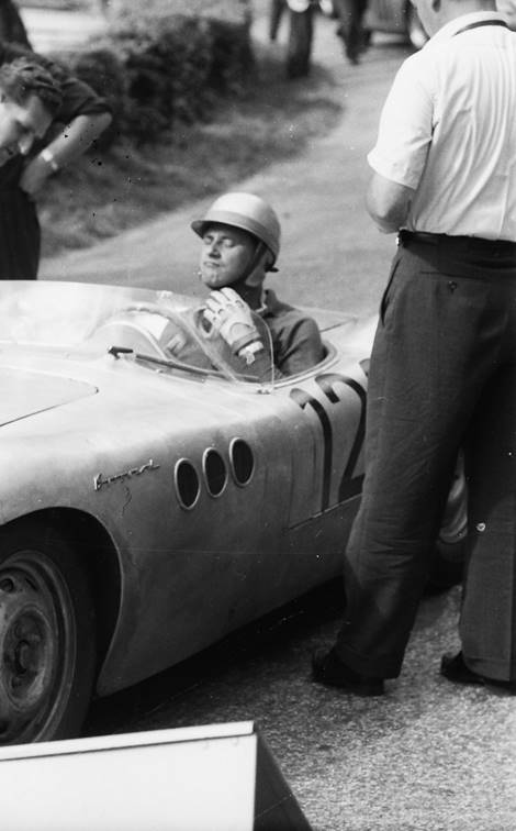 Adjusting his helmet at Ollon-Villars in 1958.