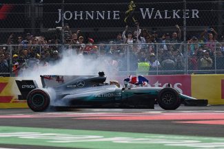 Lewis Hamilton tries some doughnuts in front of the Mexican fans in his Mercedes grand prix car on Sunday. <em>(Photo Peter Nygaard Grand Prix Photos)</em>