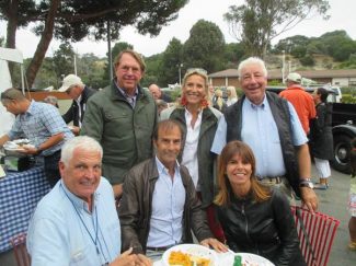 Yves Morizot, Emanuele Pirro and Marlene Pirro sitting and John Hugenholtz and his wife with Howden Ganley in Monterey