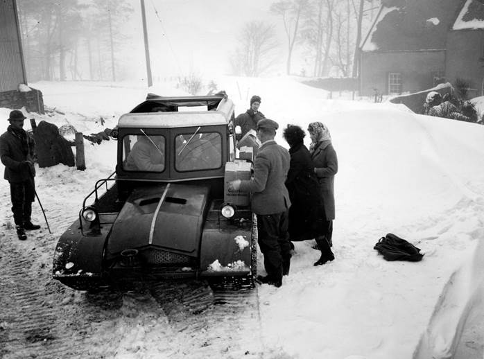 Innes delivers provisions to a stranded farmer with the Snow-Trac