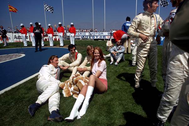 Can you imagine this at a grand prix today?  GPDC members Graham Hill, Tim Schenken, Henri Pescarolo and Howden Ganley relaxing with Ronnie Peterson and friend. (Photo Peter Nygaard: Grand Prix Photo)
