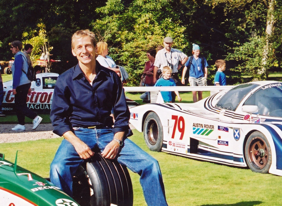 Johnny Bute, the Marquis of Bute, at the Classic event he organised on his estate on the Island of Bute in the early 1990s. Just visible behind him is the TWR Jaguar with which he won Le Mans.