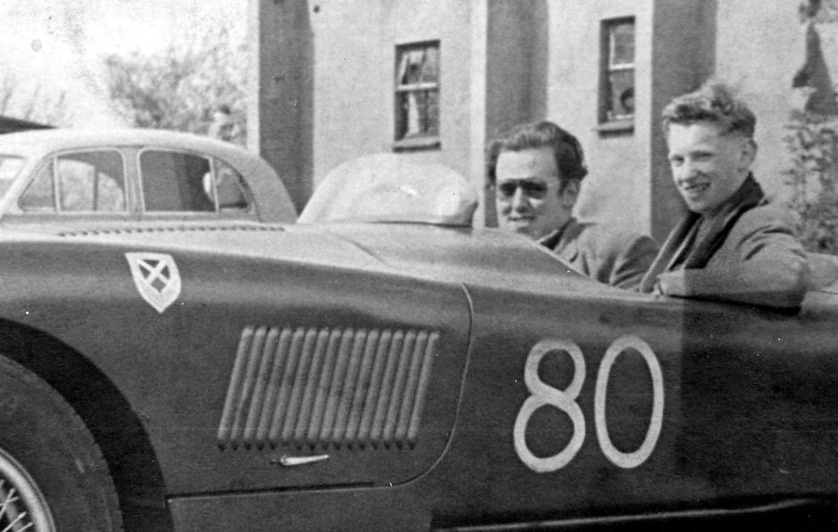 Sir James Scott Douglas, left, with his C type Jaguar and a youthful Graham Gauld photographed at Castle Combe circuit in 1953