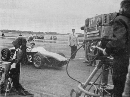 At the end of the race the writer interviews winner Peter Procter with his Lotus 19 in front of the STV cameras.