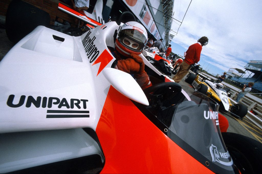 Niki Lauda (McLaren-Ford) in the pits with his helmet on during practice for the 1982 South African Grand Prix in Kyalami. Photo: Grand Prix Photo