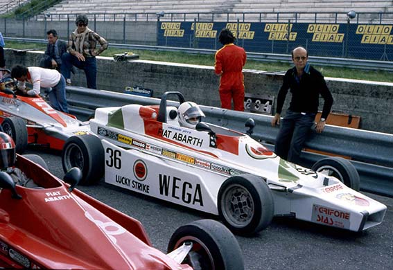 Emanuele at the wheel of the Fiat Abarth with his father looking on