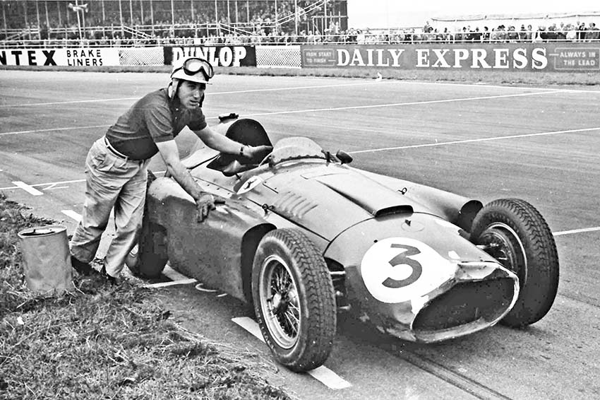 The Marquis de Portago pushes his Lancia-Ferrari across the line, British Grand Prix Silverstone 1956.