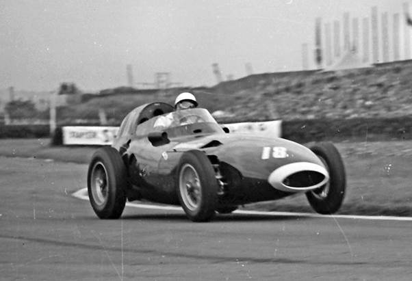 Stirling Moss in typical action at the 1957 British Grand Prix in the Vanwall