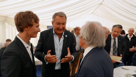 Ulysse, left, and his father Emmanuel Delsaux discussing Aspergers Syndrome with Sir Jackie Stewart.