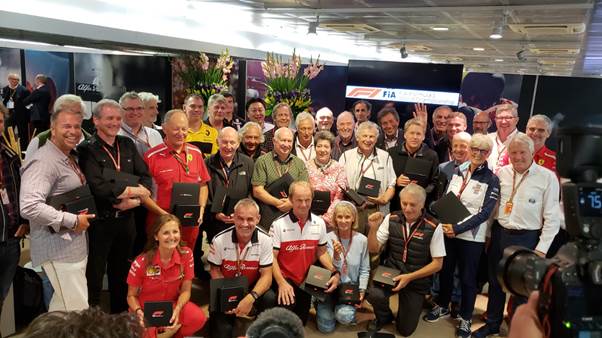 Agnes Carlier takes centre stage amongst all the inductees to the Formula 1 Paddock Hall of Fame. The judges, Charlie Whiting, Maurizio Arrivabene and Ross Brawn are on the right.